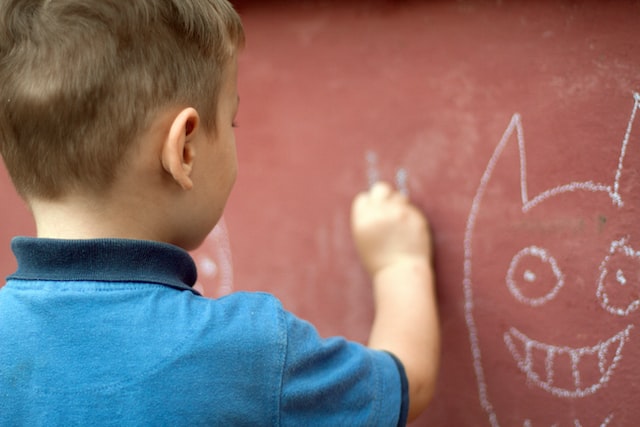 Child writing on a wall