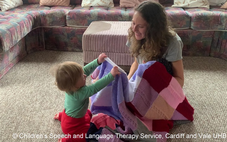 Lady playing hide and seek with son. Copyright Speech and Language Therapy Service, Cardiff and Vale UHB